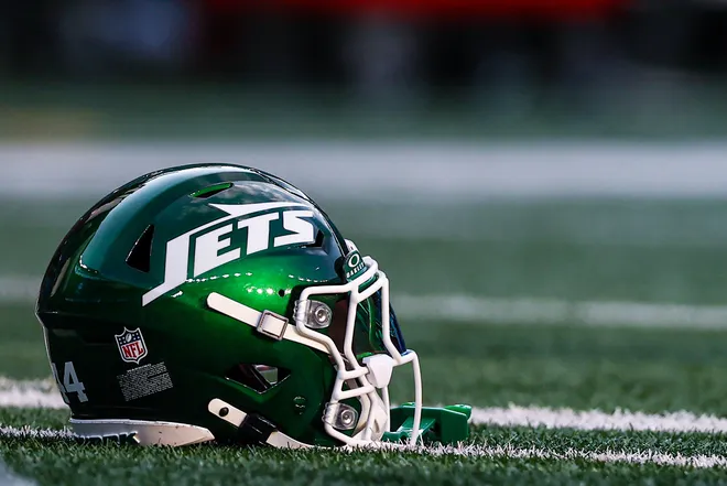 Aug 14, 2026; East Rutherford, New Jersey, USA; The helmet of New York Jets linebacker Jamien Sherwood (not pictured) rests on the field before the game against Tampa Bay Buccaneers at MetLife Stadium. Mandatory Credit: Vincent Carchietta-Imagn Images