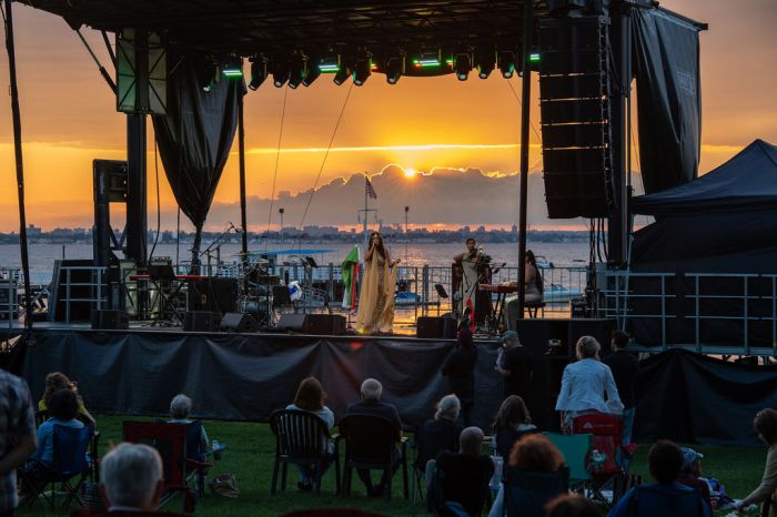 Residents and guests enjoy an evening of music and culture at Steppingstone Park.