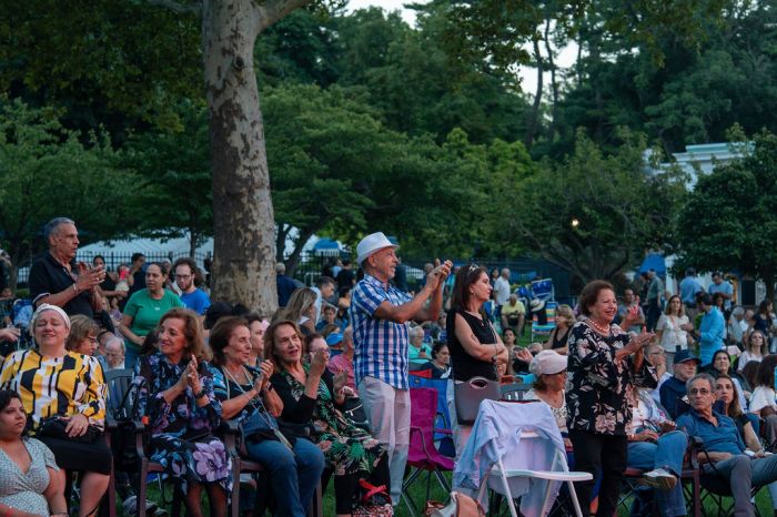 Residents and guests enjoy an evening of music and culture at Steppingstone Park.