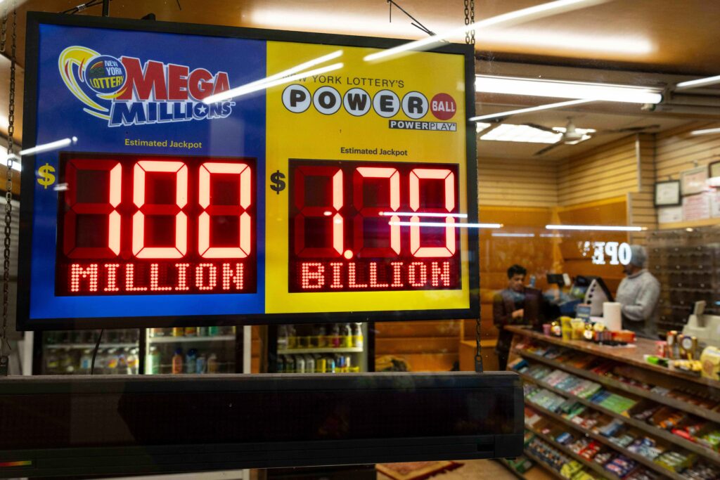 Jackpot payouts for Powerball and Mega Millions are displayed at a convenience store in the Clark Street subway station in Brooklyn Heights, Tuesday, Dec. 23, 2025, in New York. Photo: Yuki Iwamura/AP