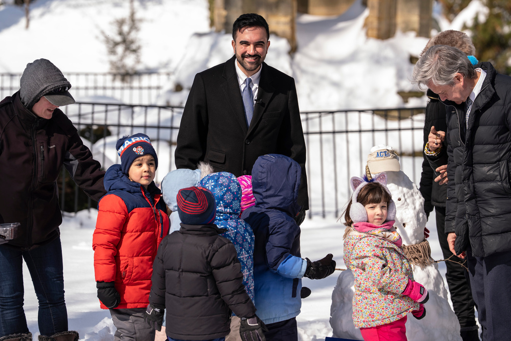 New York Mayor Zohran Mamdani and students of Pre-K and 3-K program build a snowman during a press conference in Morningside Heights, Wednesday, Feb. 25, 2026, in New York.