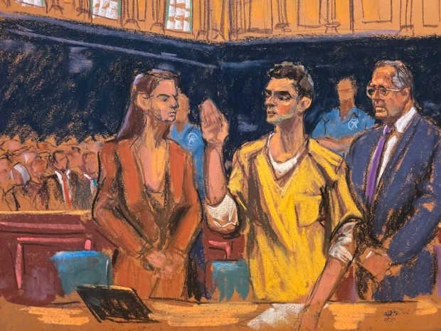 In this courtroom sketch, Luigi Mangione, center, stands between his attorneys, Karen Friedman Agnifilo, left, and Marc Agnifilo, right, as he is sworn in before pleading guilty to federal stalking charges in the killing of UnitedHealthcare CEO Brian Thompson, Friday, Aug. 14, 2026, in New York. (Jane Rosenberg via AP)