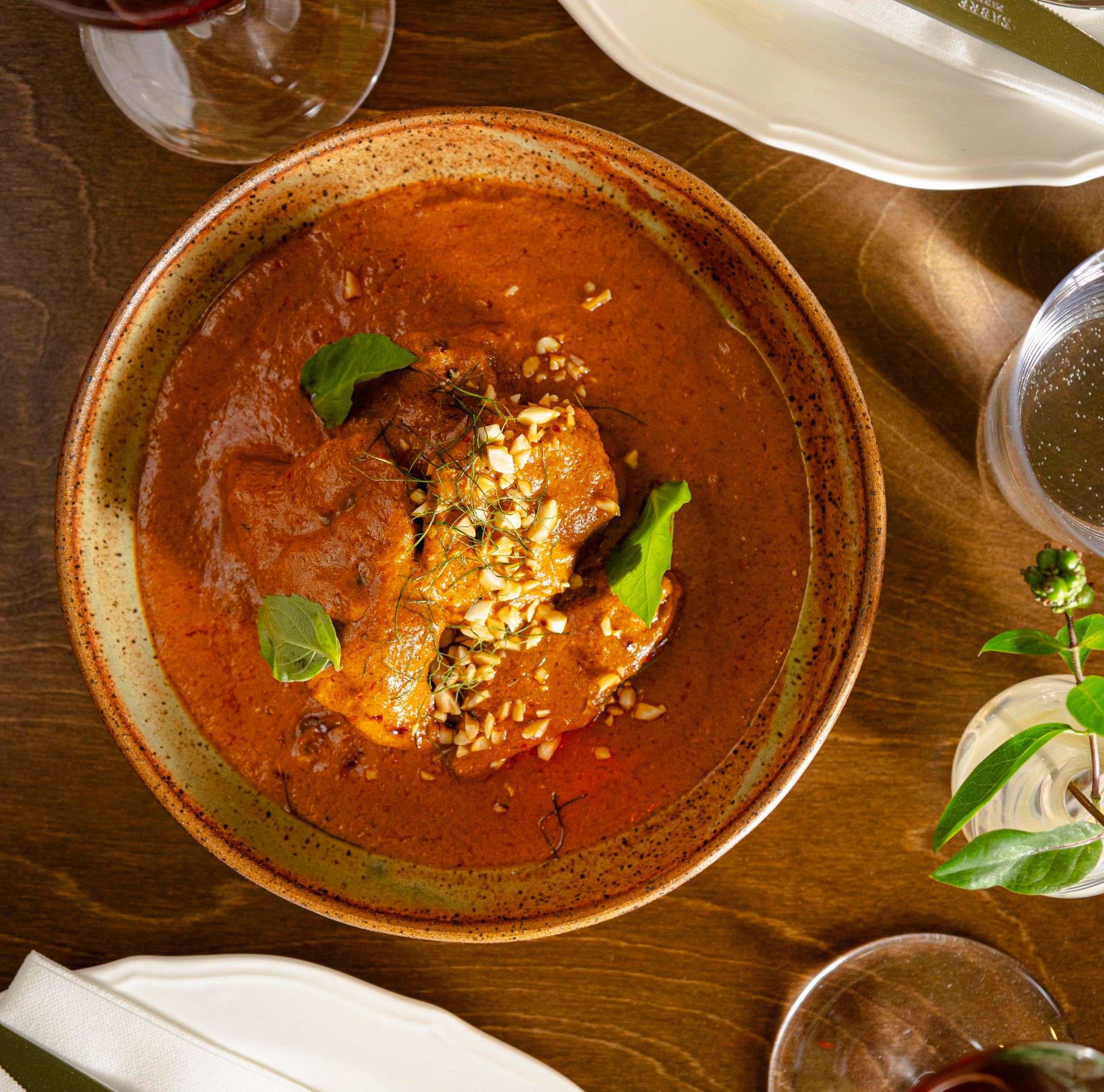 A bowl of curried meat.
