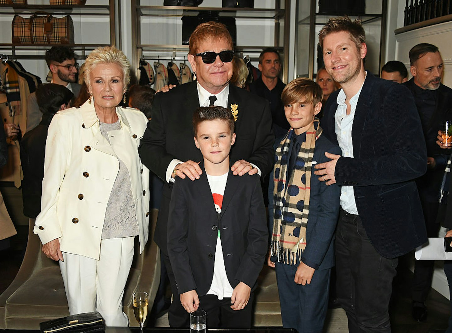 Julie Walters, Sir Elton John, Cruz Beckham, Romeo Beckham and Christopher Bailey attend the Burberry Festive film premiere at 121 Regent Street on November 3, 2015 in London, England.