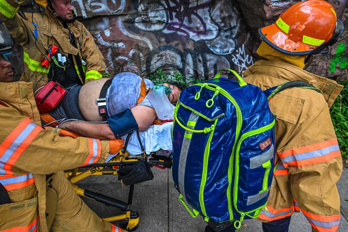 EMS carry out person on stretcher injured in Bronx explosion
