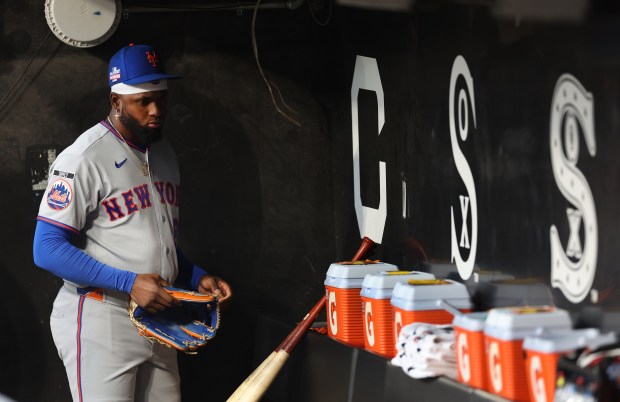 Mets left fielder Luis Robert Jr. stands in the dugout before a game against the White Sox on Friday, Aug. 21, 2026, at Rate Field. (Chris Sweda/Chicago Tribune)