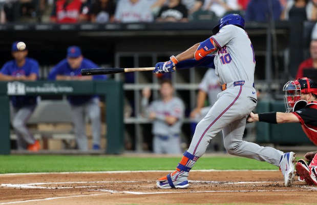 Mets second baseman Marcus Semien hits an RBI single in the second inning against the White Sox on Aug. 21, 2026, at Rate Field. (Chris Sweda/Chicago Tribune)