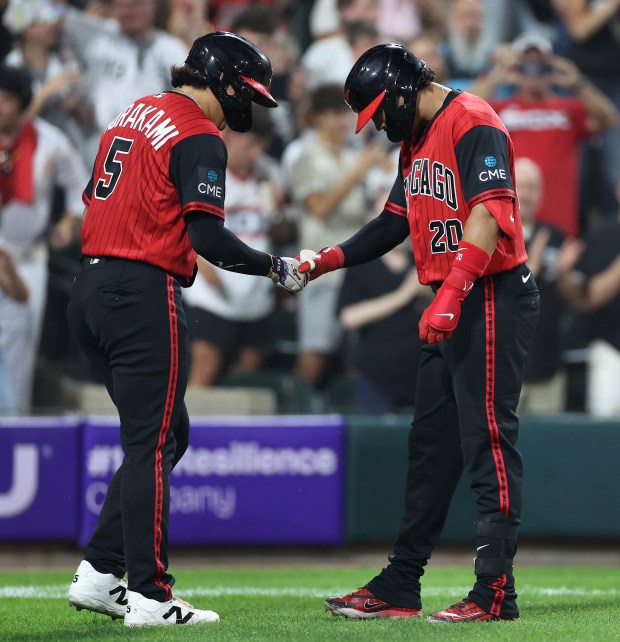 White Sox third baseman Miguel Vargas, right, celebrates with Munetaka Murakami after hitting a two-run home run in the sixth inning against the Mets on Aug. 21, 2026, at Rate Field. (Chris Sweda/Chicago Tribune)