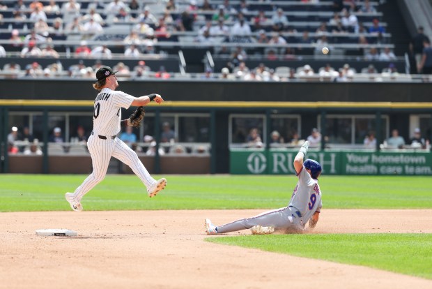 Chicago White Sox second baseman Chase Meidroth (10) gets New York Mets center fielder A.J. Ewing (9) out at second base as he throws to first base in the third inning at Rate Field on Aug. 23, 2026. (Eileen T. Meslar/Chicago Tribune)