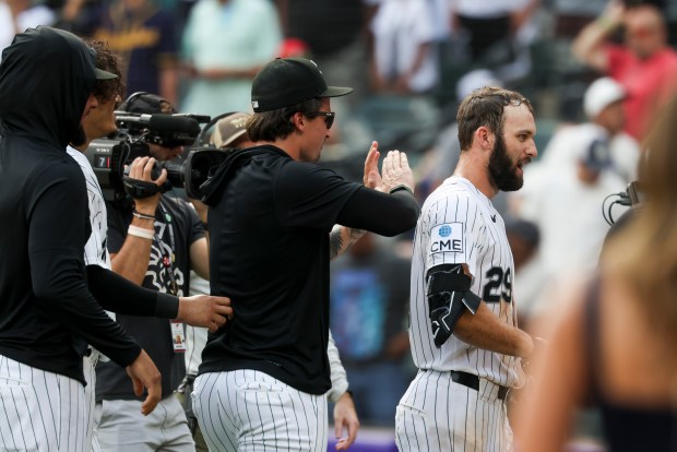 Chicago White Sox players celebrate with Tristan Peters (29) after he hit a home run in the ninth inning to win the game 2-1 against the New York Mets at Rate Field on Aug. 23, 2026. (Eileen T. Meslar/Chicago Tribune)