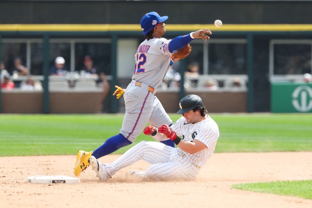 New York Mets shortstop Francisco Lindor (12) throws to first base after getting Chicago White Sox designated hitter Andrew Benintendi (23) out at second base in the sixth inning at Rate Field on Aug. 23, 2026. (Eileen T. Meslar/Chicago Tribune)