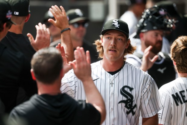 Chicago White Sox pitcher Hagen Smith (32) gets high-fives after pitching in the seventh inning against the New York Mets at Rate Field on Aug. 23, 2026. (Eileen T. Meslar/Chicago Tribune)