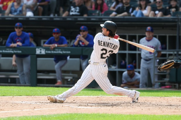 Chicago White Sox designated hitter Andrew Benintendi (23) hits an RBI double in the eighth inning against the New York Mets at Rate Field on Aug. 23, 2026. (Eileen T. Meslar/Chicago Tribune)