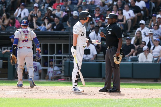 Chicago White Sox shortstop Colson Montgomery (12) speaks to the umpire after striking out in the eighth inning against the New York Mets at Rate Field on Aug. 23, 2026. (Eileen T. Meslar/Chicago Tribune)
