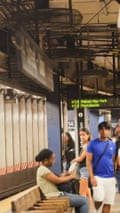 Commuters get gusts of hot air from a dust-clogged overhead fans at 14th-Street Union Square.