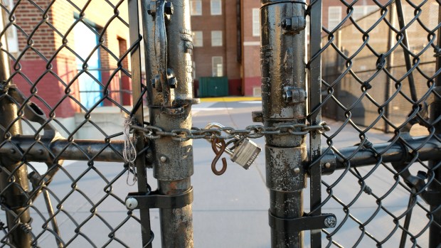 Gates at the entrance to New York City Public School 52 are pictured locked in Jamaica, Queens on Nov. 24, 2020, during the COVID-19 pandemic. (Luiz C. Ribeiro for New York Daily News)