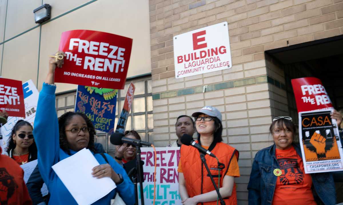 Residents protest to freeze the rent outside LaGuardia Community College. Photo by Lloyd Mitchell.