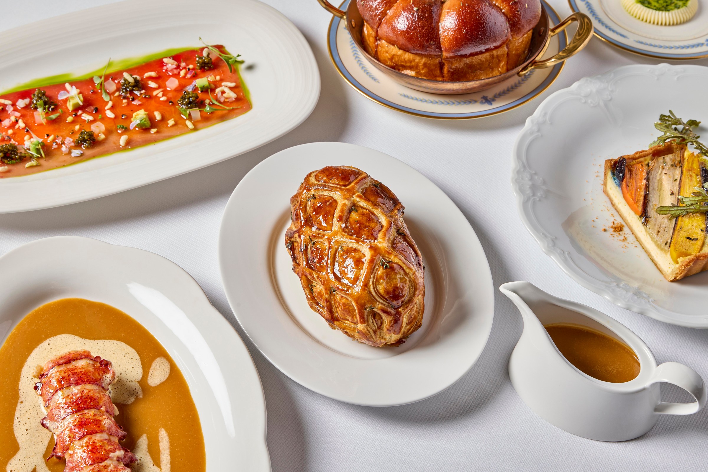 Various dishes at Elder, including the beet Wellington.