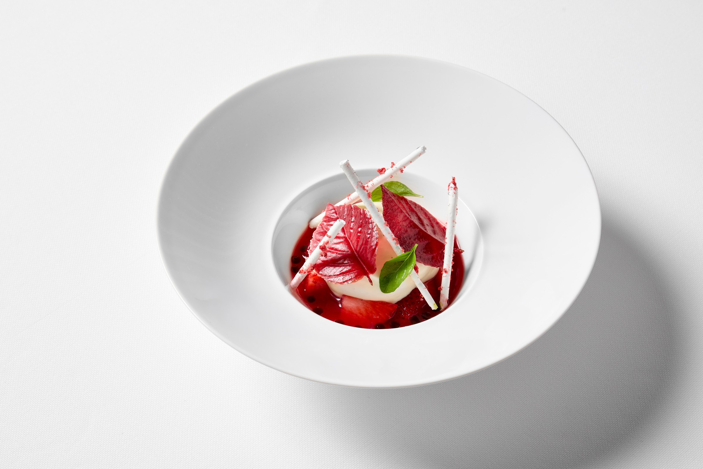A strawberry dessert in a white bowl.