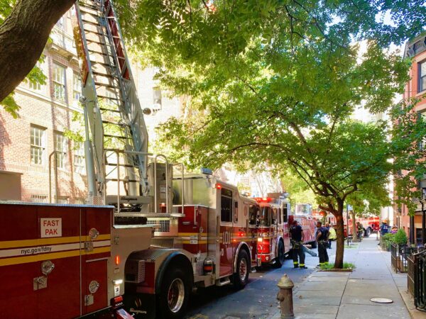 Orange and Hicks streets on Sunday were lined with engine companies and ladder trucks. Photo: Mary Frost/Brooklyn Eagle
