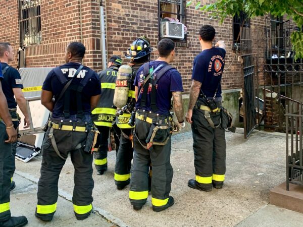 FDNY responders examine the site after the 35 Orange St. blaze was extinguished. Photo: Mary Frost/Brooklyn Eagle