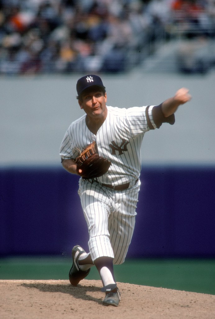 Tommy John #25 of the New York Yankees pitches during a Major League Baseball game circa 1980