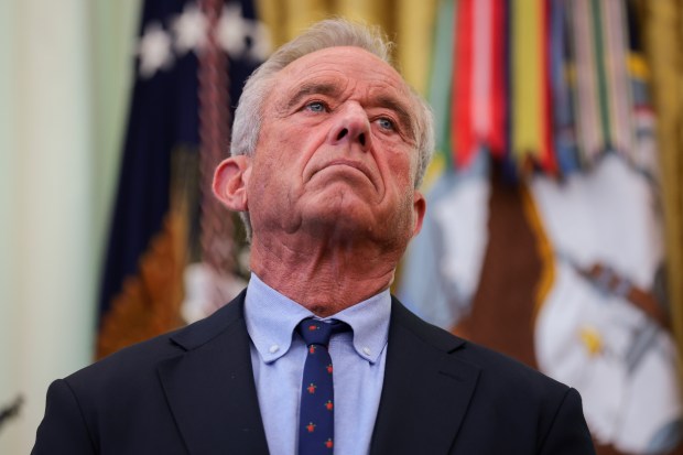 Health and Human Services Secretary Robert F. Kennedy Jr. joins U.S. President Donald Trump as he signs an executive order calling for childhood vaccine shots to be spaced out into separate visits.