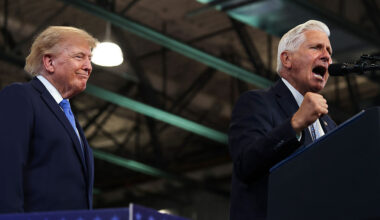 President Donald Trump listens as New York Republican gubernatorial nominee Bruce Blakeman speaks at an event Friday in Garden City, N.Y.