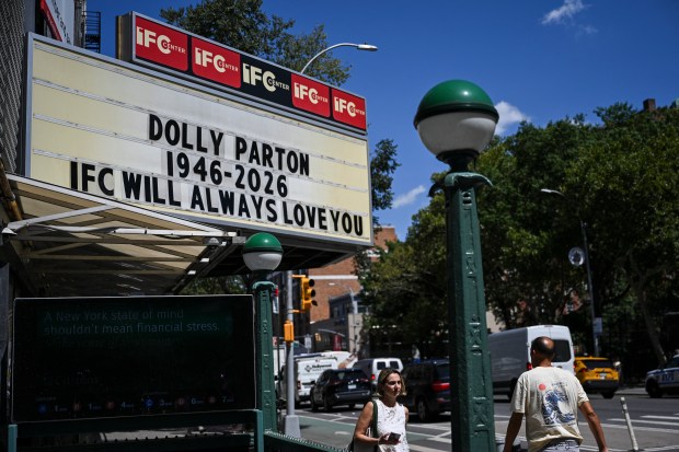 A tribute reading "Dolly Parton 1946-2026. IFC will always love you" is displayed on the marquee of the IFC Center in Greenwich Village on Wednesday, Aug. 26, 2026 in Manhattan, New York. (Photo by ANGELA WEISS / AFP via Getty Images)