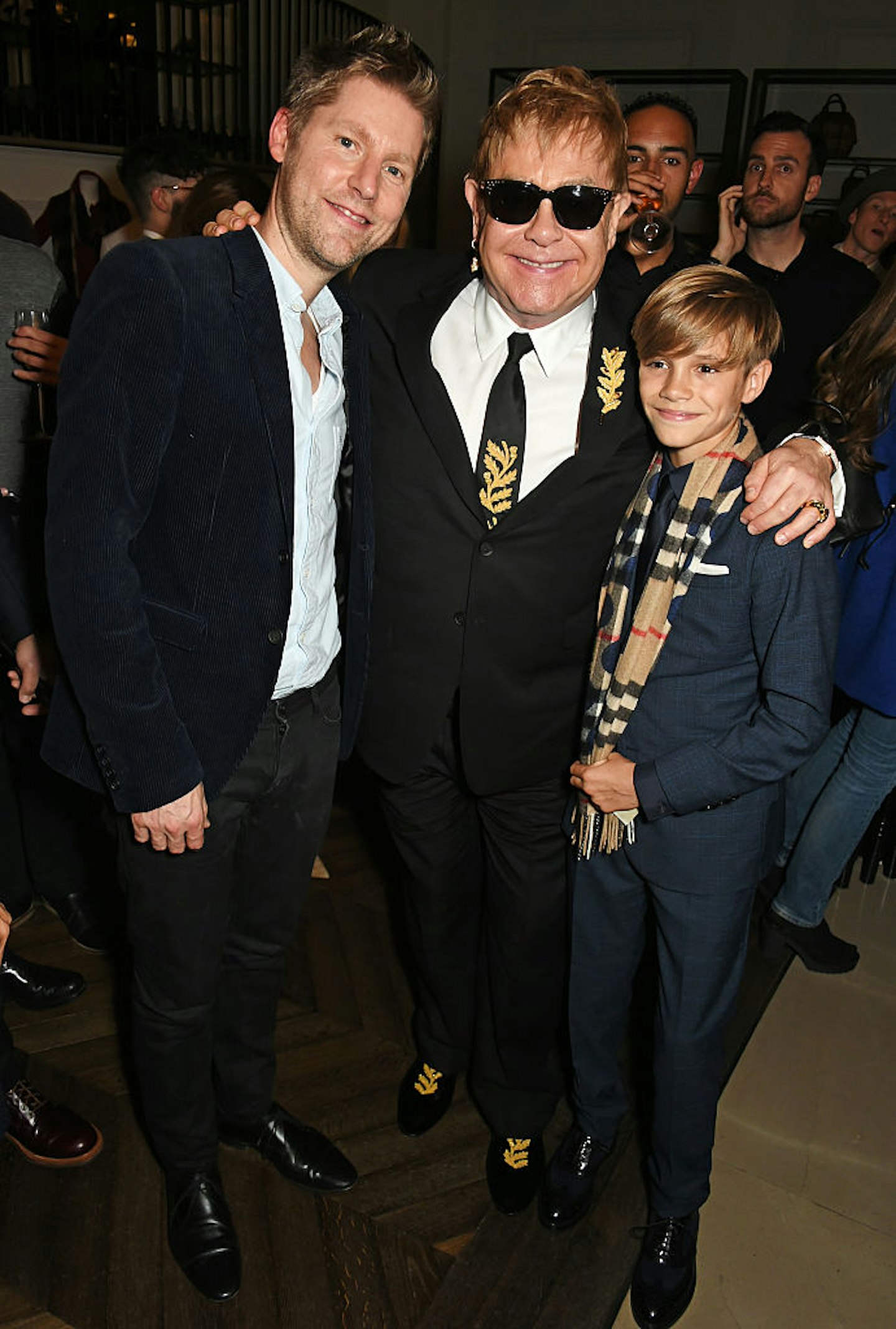Christopher Bailey, Sir Elton John and Romeo Beckham attend the Burberry Festive film premiere at 121 Regent Street