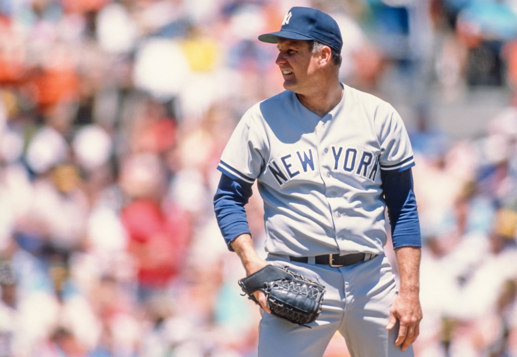 Tommy John of the New York Yankees pitches in a Major League Baseball game against the Oakland Athletics played on May 18, 1989 at the Oakland-Alameda County Coliseum in Oakland, California. Tommy John was 46 years old at the time. 