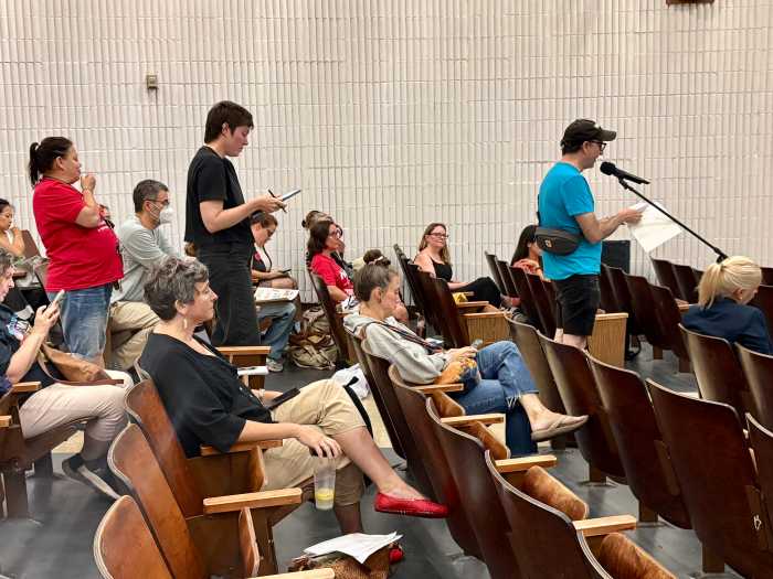 Speakers waited in line to comment both on contracts to be approved and for open thoughts, many waiting for a period of three hours to speak both about contracts with big tech companies and on the lack of DOE's comprehensive AI policy just two weeks ahead of the new school year.