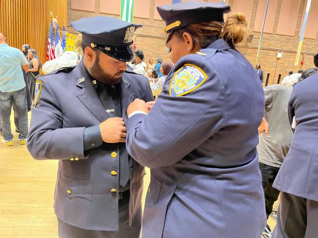 TLC cadets receive their shields on Tuesday at One Police Plaza.