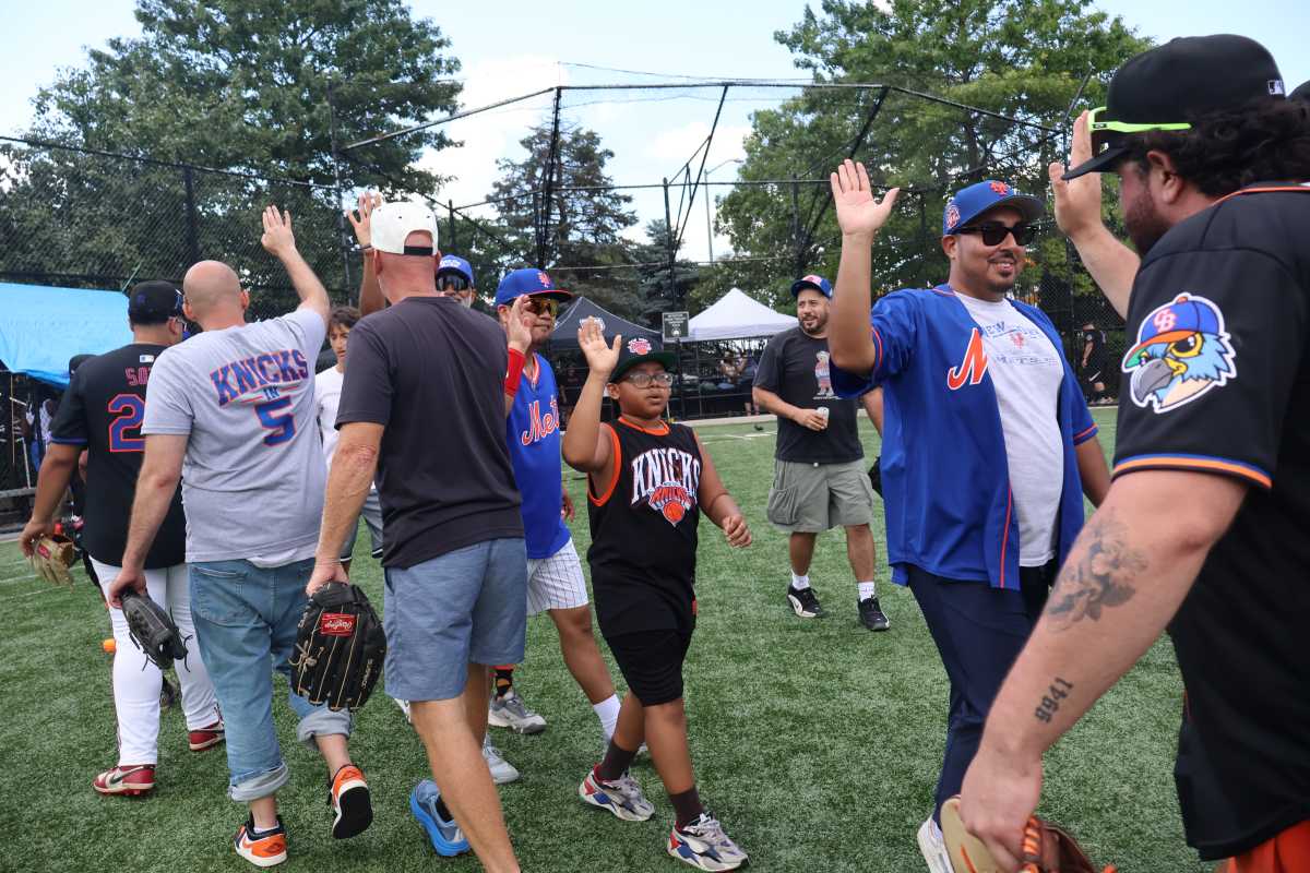 The Queens community came together for the fourth annual Friends and Family Softball Game.