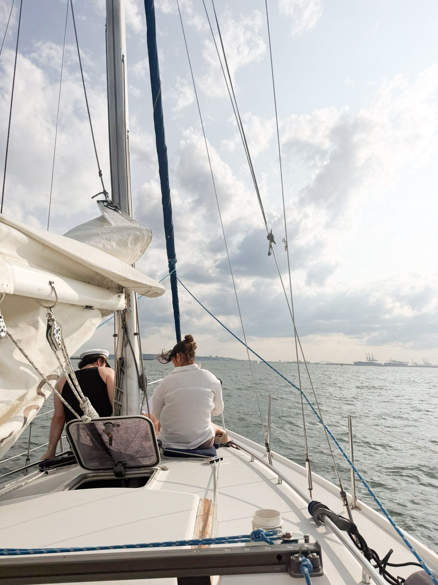 Image may contain Boat Sailboat Transportation Vehicle Yacht Adult Person Nature Outdoors Sky Clothing and Hat