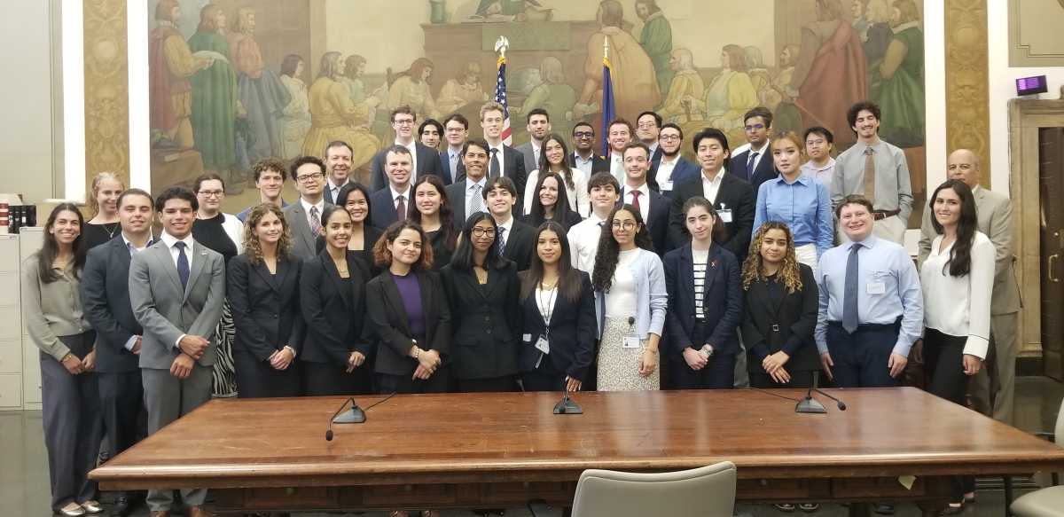 State Supreme Court Justice Joel M. Cohen and attorneys Andrew Rossman and Lara Flath with the summer court interns whom they spoke to. 
