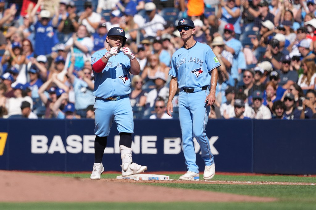 Toronto Blue Jays catcher Alejandro Kirk (30) celebrates hitting an RBI single against the New York Yankees during the third inning at Rogers Centre. 