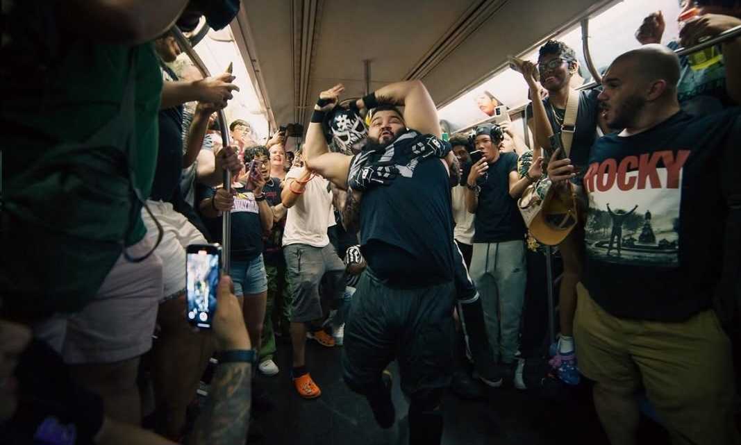 A wrestling match taking place in the subway during Subway Mania.