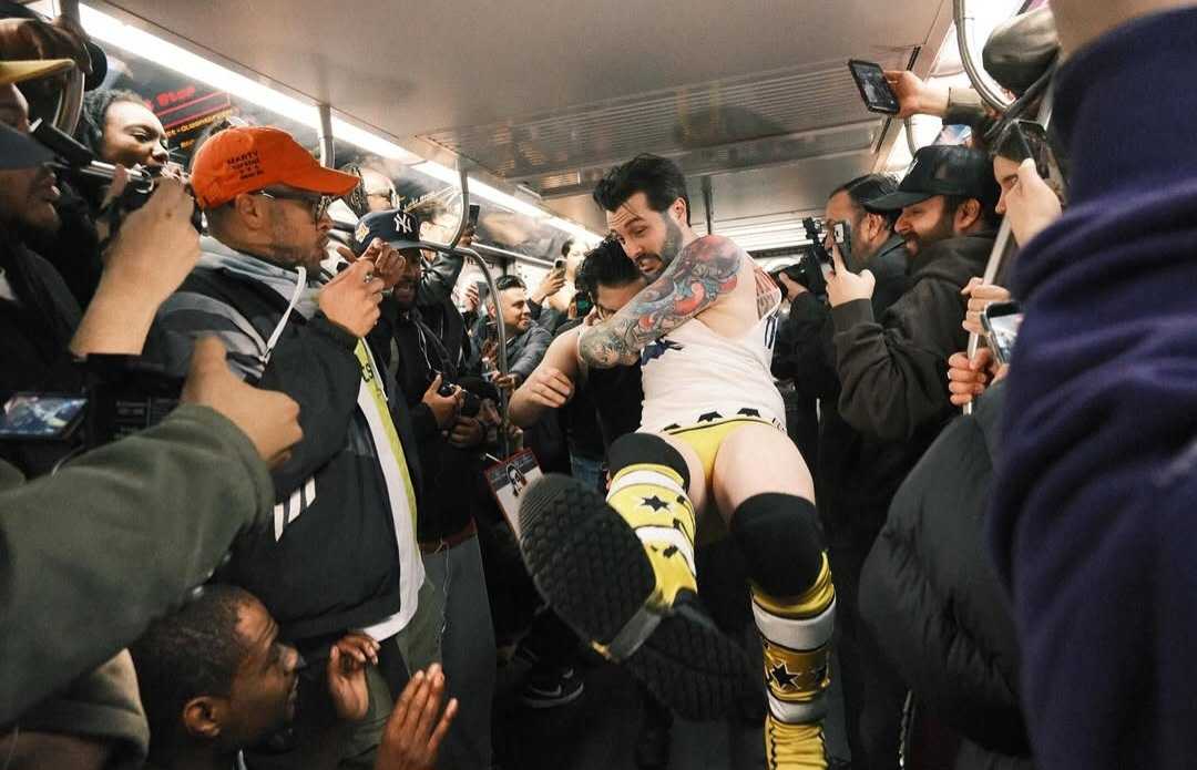 A wrestling match taking place in the subway during Subway Mania.