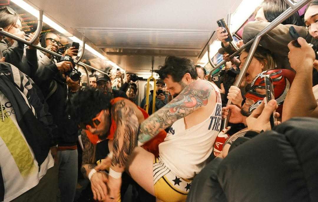 A wrestling match taking place in the subway during Subway Mania.