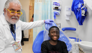 Dr. Robert Pellecchia with patient Ousman Ceesay at his post-op visit
