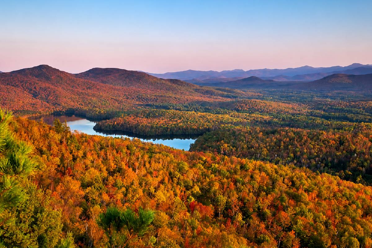 This enormous 6 million-acre New York park is bigger than Yellowstone, Yosemite, Grand Canyon, Glacier and Zion combined—and you can see its fall color by gondola, plane or hot air balloon