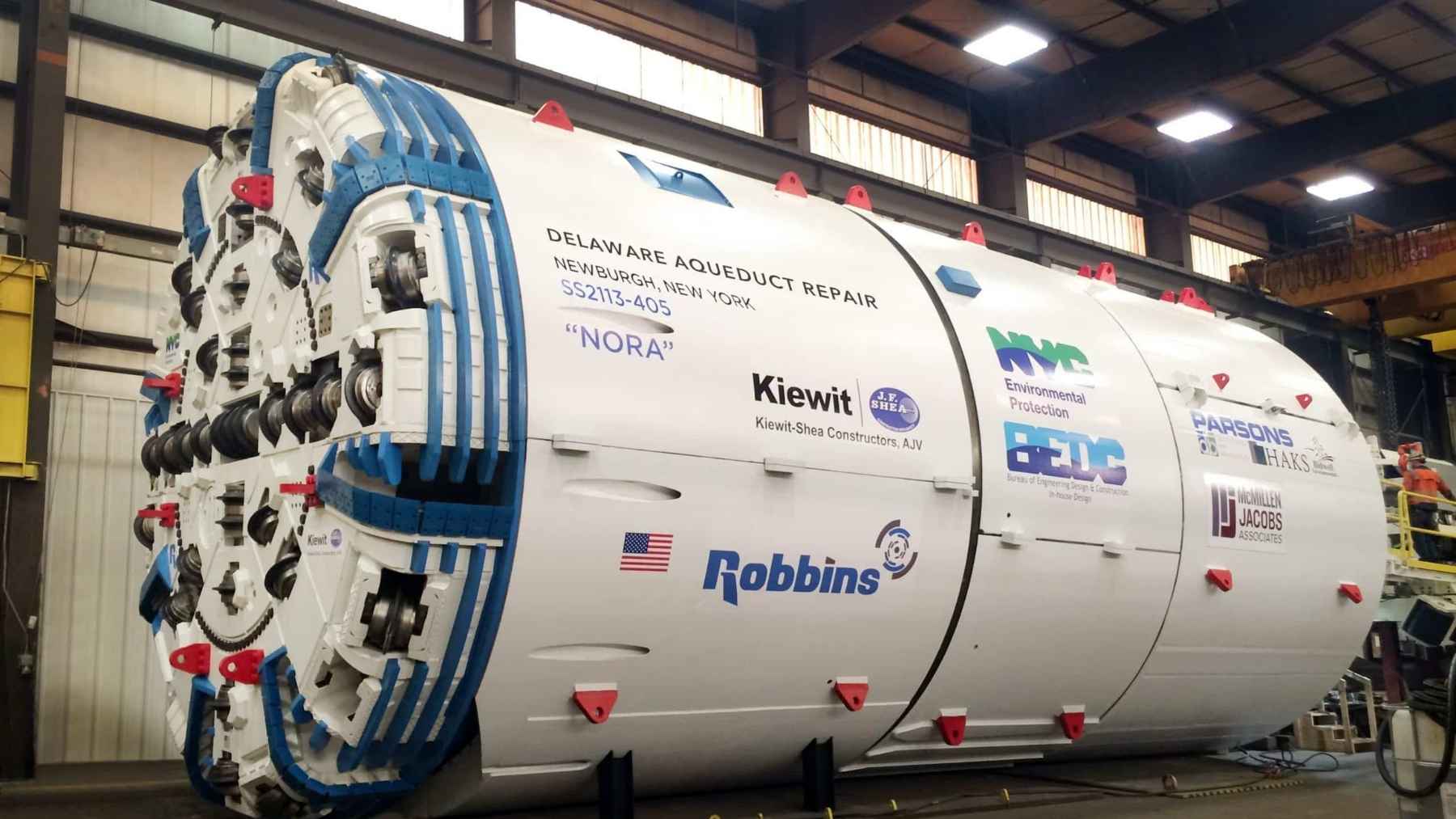 A 1,350-ton machine named Nora arrived in 22 pieces, took four months to bolt together and bored 2.5 miles under the Hudson to carry half of New York’s drinking water around a leaking crack, and the tunnel she cut has never held a drop
