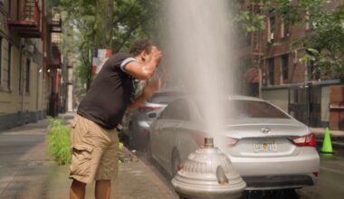 Is it safe to cool off under an open fire hydrant?
