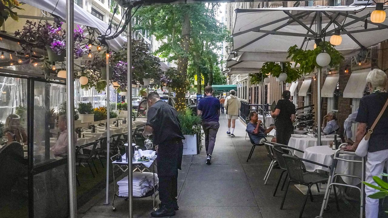 The City Council is expected to approve legislation allowing roadway dining to operate throughout the year. (AP Photo, File)