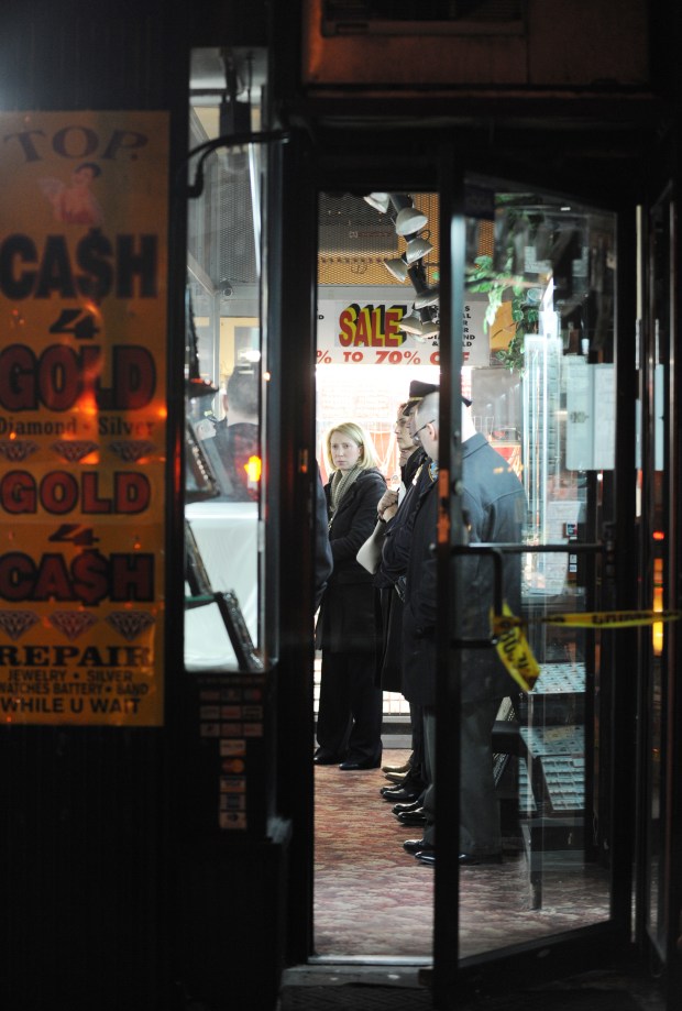 Investigators are pictured in the World of Gold N Diamond at Church and Duane Sts. in Manhattan, where Omid Gholian was found dead, is pictured on Feb. 15, 2017. (Sam Costanza for New York Daily News)