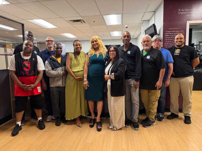 Members of the QPTV team stand alongside Nieves, whose staff has worked tirelessly to support her vision and help usher the network into its next chapter. 