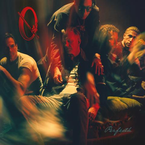 Image may contain Josh Homme Club Face Head Person Photography Portrait Adult Urban Concert Crowd and Night Club