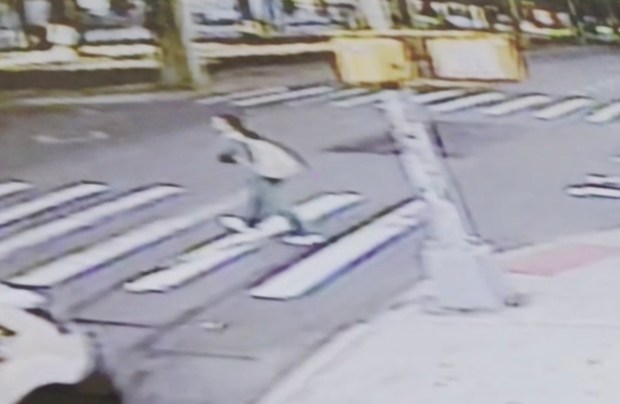 Surveillance footage shows victim Jiayi Zheng walking in the crosswalk at 55th St. at Third Ave. in Sunset Park before being fatally struck by a hit-and-run driver. (Obtained by NYDN)