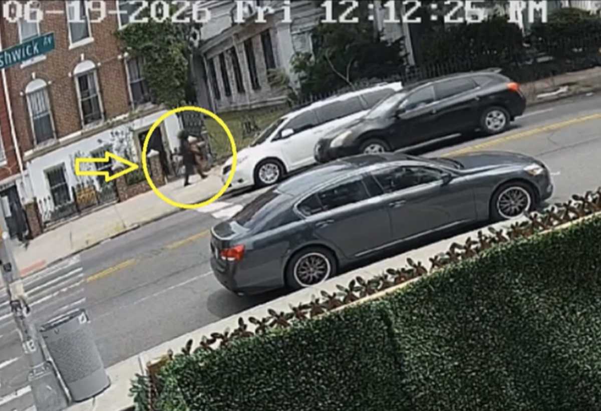 Surveillance video shows someone believed to be the suspect approaching the church around 12:12 pm on the day of the fire. Image via Eastern District of New York
